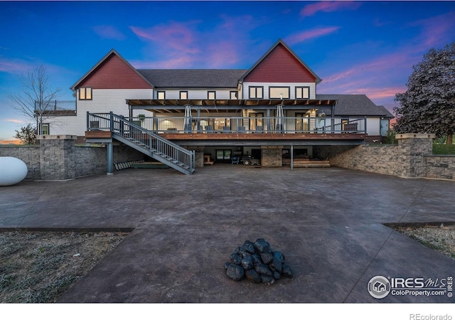 6950 W County Road 18, Loveland, CO 80537 - back of property featuring a wooden deck and stairway