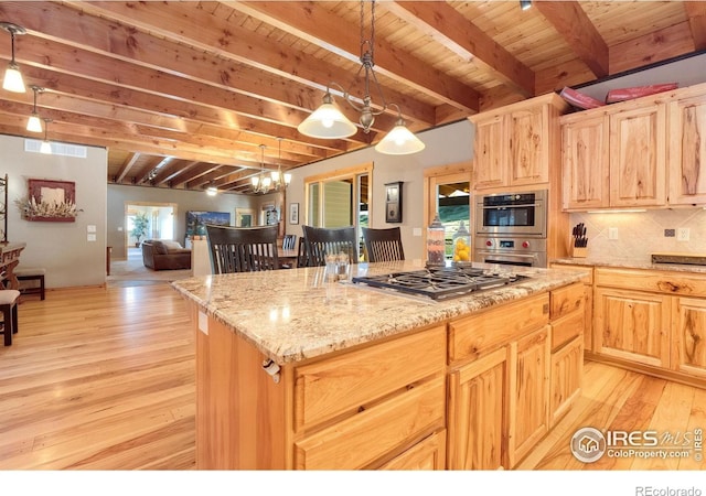 6950 W County Road 18, Loveland, CO 80537 - kitchen featuring stainless steel appliances, beam ceiling, light wood-style floors, light brown cabinets, and wooden ceiling