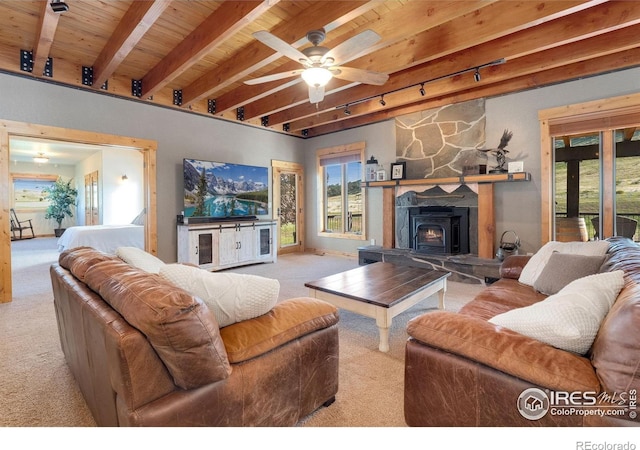 6950 W County Road 18, Loveland, CO 80537 - living area featuring carpet, rail lighting, beam ceiling, wooden ceiling, and a ceiling fan