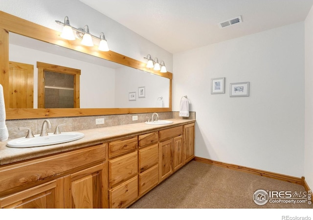 6950 W County Road 18, Loveland, CO 80537 - bathroom featuring double vanity, baseboards, and an enclosed shower