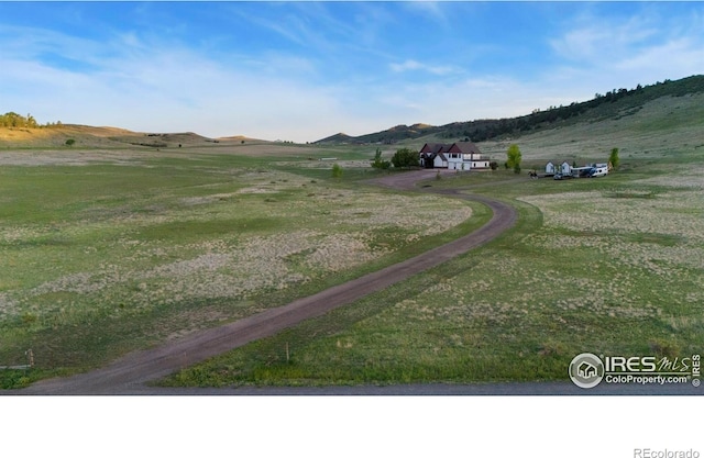 6950 W County Road 18, Loveland, CO 80537 - view of dirt / gravel road with a view of rural / pastoral area