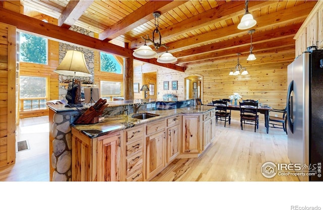 315 County Road 4454, Grand Lake, CO 80447 - kitchen with freestanding refrigerator, a sink, wooden ceiling, wood walls, and light wood-type flooring