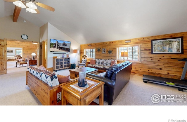 315 County Road 4454, Grand Lake, CO 80447 - carpeted living room featuring wooden walls, ceiling fan, high vaulted ceiling, and beamed ceiling