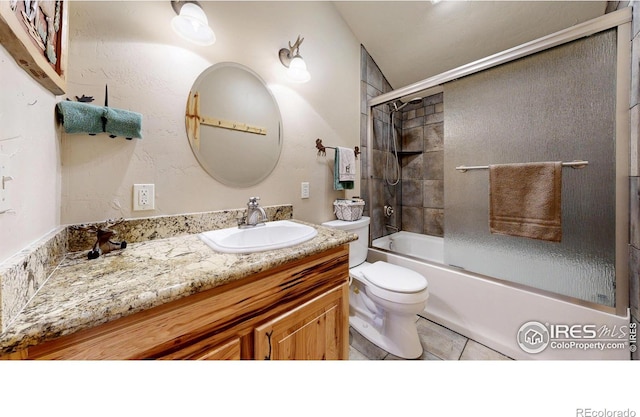 315 County Road 4454, Grand Lake, CO 80447 - bathroom featuring toilet, vanity, tile patterned floors, shower / bath combination with glass door, and lofted ceiling