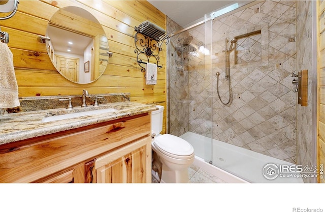 315 County Road 4454, Grand Lake, CO 80447 - full bathroom with a stall shower, toilet, vanity, and wood walls