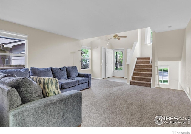 1724 Holeman Dr, Erie, CO 80516 - living area with stairway, carpet flooring, ceiling fan, and baseboards