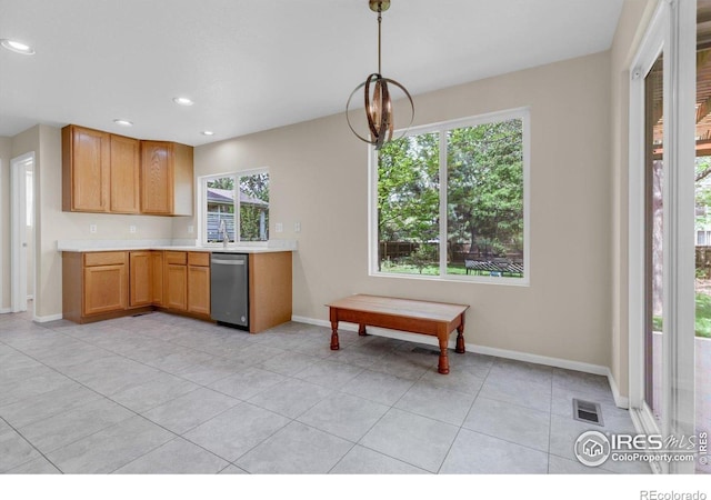1724 Holeman Dr, Erie, CO 80516 - kitchen featuring dishwasher, light countertops, light tile patterned floors, baseboards, and recessed lighting