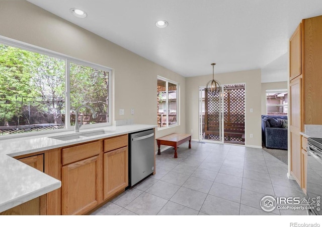 1724 Holeman Dr, Erie, CO 80516 - kitchen with stainless steel dishwasher, a sink, light countertops, light tile patterned floors, and pendant lighting