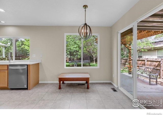 1724 Holeman Dr, Erie, CO 80516 - dining room featuring baseboards, light tile patterned floors, recessed lighting, and a chandelier