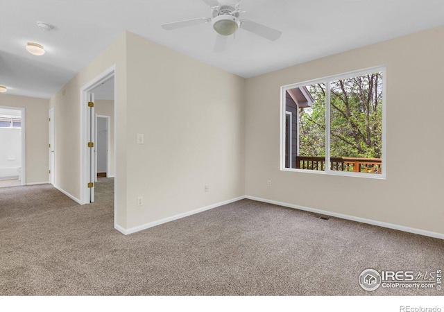 1724 Holeman Dr, Erie, CO 80516 - carpeted spare room featuring baseboards and a ceiling fan