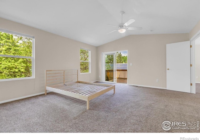 1724 Holeman Dr, Erie, CO 80516 - unfurnished bedroom featuring access to outside, carpet, vaulted ceiling, baseboards, and a ceiling fan