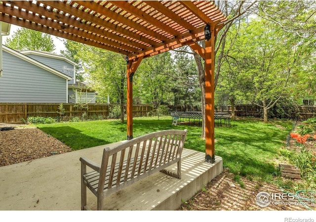 1724 Holeman Dr, Erie, CO 80516 - view of patio featuring a pergola and a trampoline