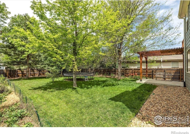 1724 Holeman Dr, Erie, CO 80516 - view of yard featuring a trampoline, a pergola, and a patio area
