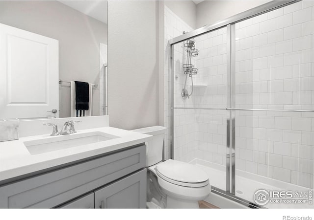 5085 Blanchette St, Timnath, CO 80547 - bathroom with tiled shower, toilet, and vanity