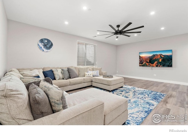 5085 Blanchette St, Timnath, CO 80547 - living area featuring recessed lighting, ceiling fan, wood finished floors, and baseboards