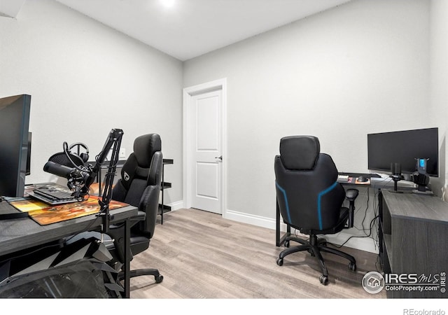5085 Blanchette St, Timnath, CO 80547 - home office featuring wood finished floors and baseboards