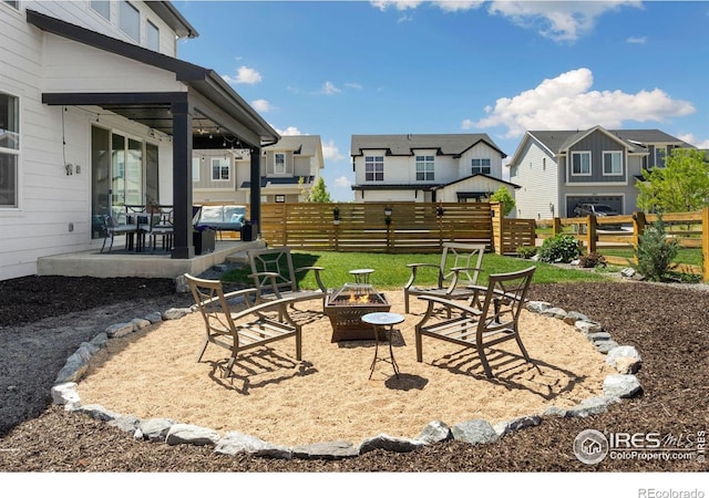 5085 Blanchette St, Timnath, CO 80547 - view of yard featuring an outdoor fire pit, a patio area, and a residential view