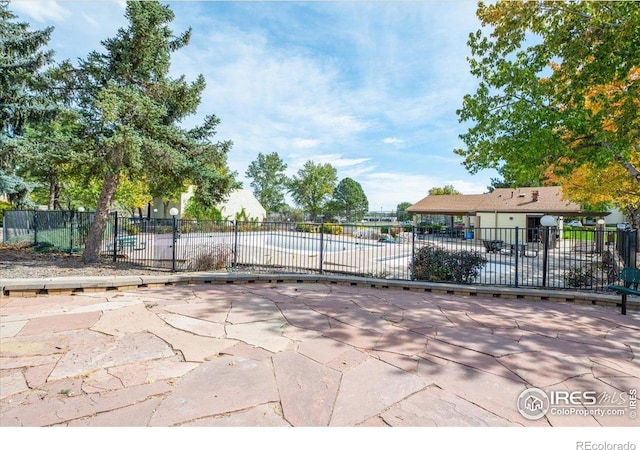 7820 W 87th Dr Unit K, Arvada, CO 80005 - view of home's community featuring fence and a patio
