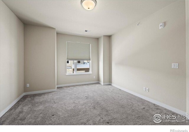 350 High Point Dr Unit 201, Longmont, CO 80504 - empty room with carpet and baseboards