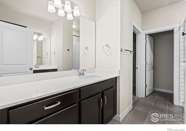 350 High Point Dr Unit 201, Longmont, CO 80504 - full bathroom featuring tile patterned flooring, baseboards, and vanity