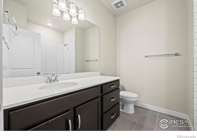 350 High Point Dr Unit 201, Longmont, CO 80504 - full bath with tile patterned flooring, vanity, toilet, baseboards, and a shower