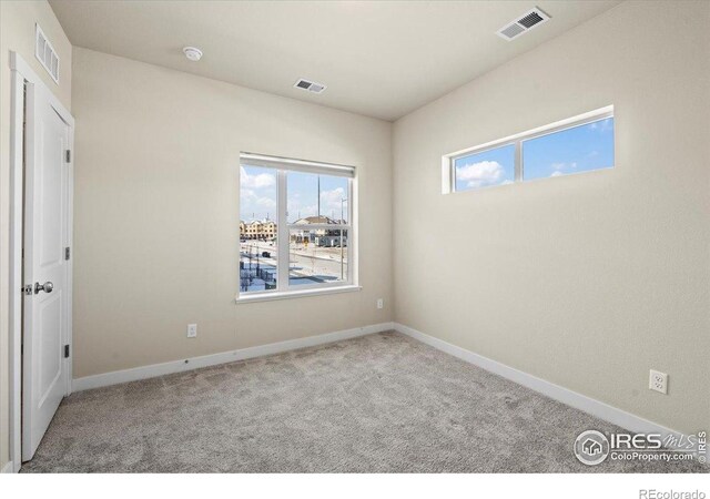 350 High Point Dr Unit 201, Longmont, CO 80504 - carpeted spare room featuring baseboards