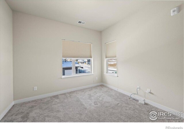 350 High Point Dr Unit 201, Longmont, CO 80504 - carpeted empty room featuring baseboards
