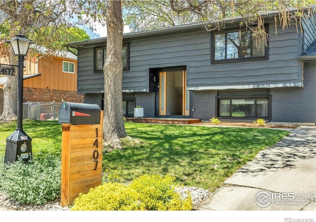 1407 S Terry St, Longmont, CO 80501 - bi-level home with brick siding