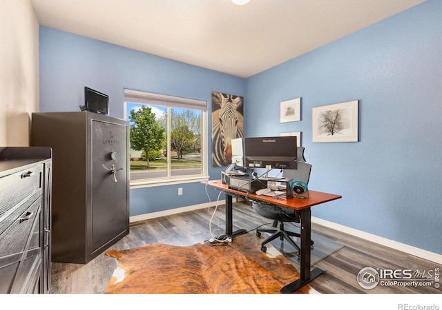 office with wood finished floors and baseboards
