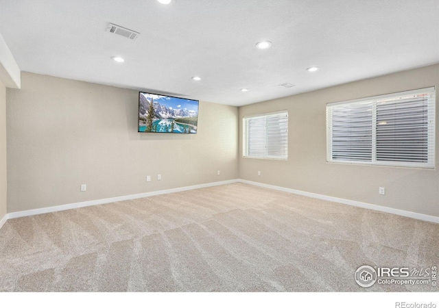 unfurnished room featuring carpet, baseboards, and recessed lighting