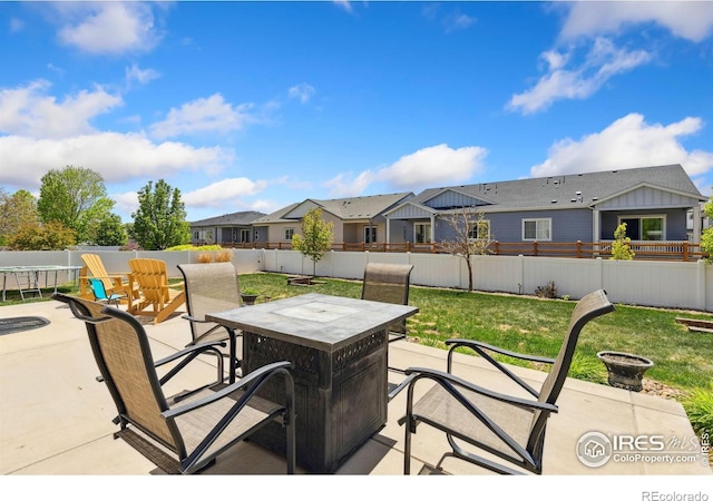 view of patio / terrace featuring outdoor dining area and a residential view
