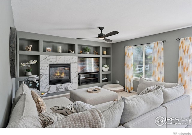 4416 Pika Dr, Loveland, CO 80537 - living room featuring a high end fireplace, a ceiling fan, and carpet floors
