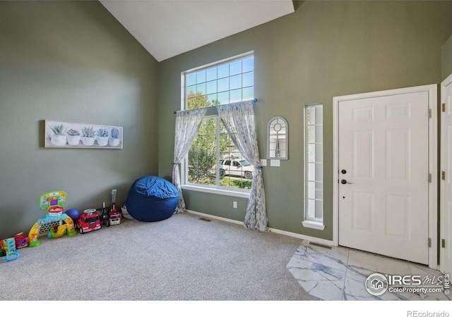 4416 Pika Dr, Loveland, CO 80537 - foyer featuring high vaulted ceiling, carpet flooring, and baseboards
