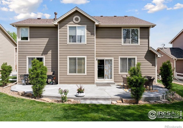 4416 Pika Dr, Loveland, CO 80537 - rear view of property with a patio and a yard