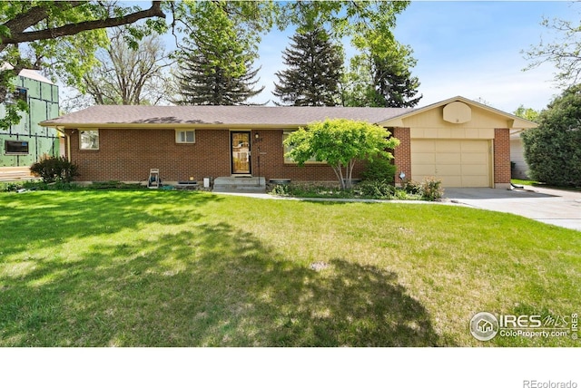 1320 Lory St, Fort Collins, CO 80524 - ranch-style house with brick siding, a garage, driveway, and a front yard