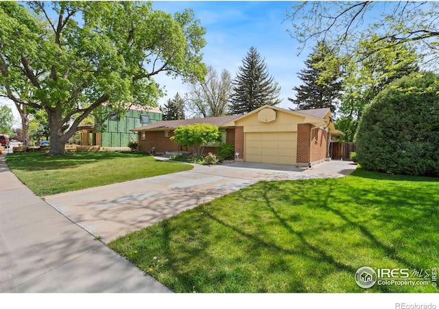 1320 Lory St, Fort Collins, CO 80524 - ranch-style house with concrete driveway, an attached garage, and brick siding
