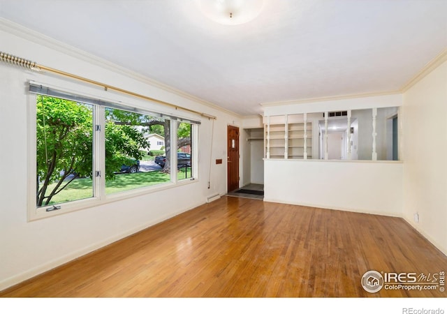 1320 Lory St, Fort Collins, CO 80524 - unfurnished room featuring wood finished floors, ornamental molding, and baseboards