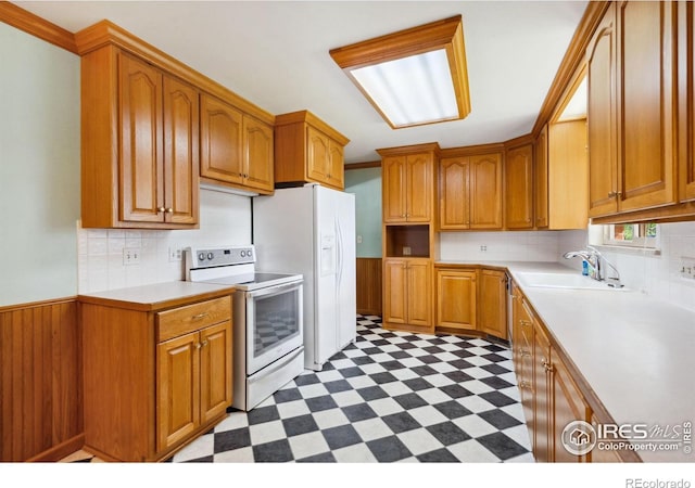 1320 Lory St, Fort Collins, CO 80524 - kitchen with white appliances, a sink, light floors, and light countertops