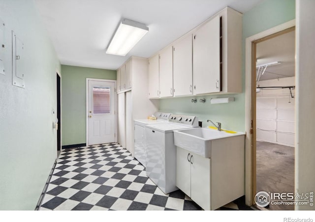 1320 Lory St, Fort Collins, CO 80524 - laundry area with cabinet space, washing machine and clothes dryer, and light flooring