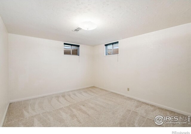 1320 Lory St, Fort Collins, CO 80524 - below grade area featuring carpet, a textured ceiling, and baseboards