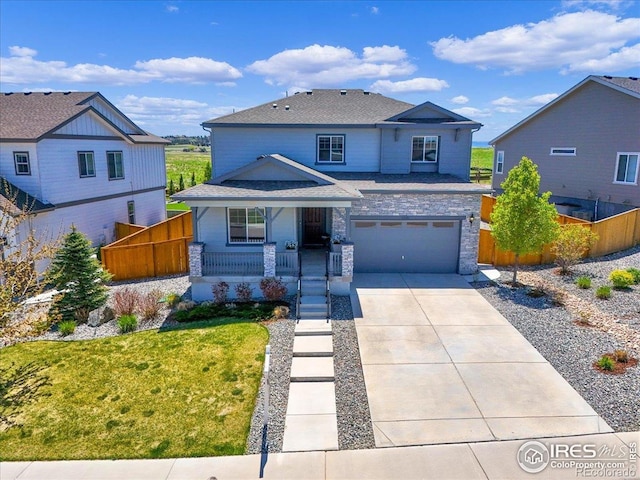 6506 Merrimack Dr, Castle Pines, CO 80108 - view of front of house featuring covered porch, concrete driveway, a garage, a shingled roof, and stone siding