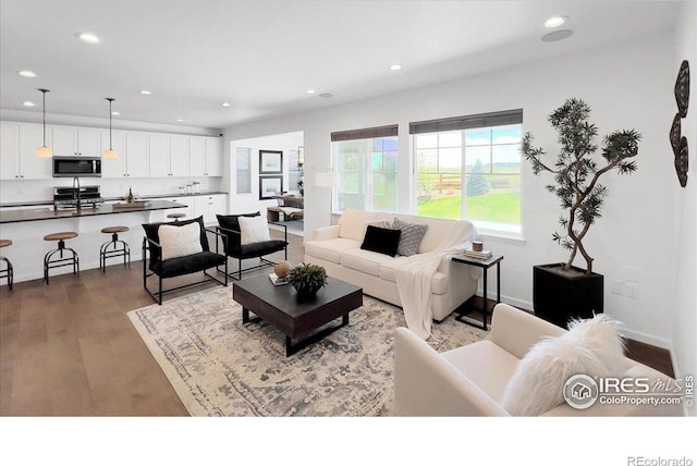 6506 Merrimack Dr, Castle Pines, CO 80108 - living room with recessed lighting, wood finished floors, and baseboards