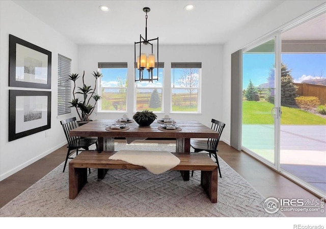 6506 Merrimack Dr, Castle Pines, CO 80108 - dining area featuring recessed lighting, a chandelier, wood finished floors, and baseboards