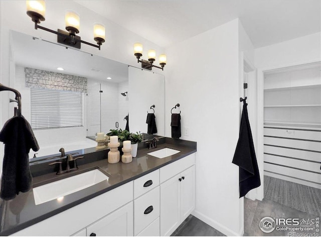 6506 Merrimack Dr, Castle Pines, CO 80108 - bathroom with a shower stall, baseboards, double vanity, and a bathtub