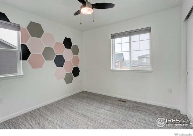 6506 Merrimack Dr, Castle Pines, CO 80108 - empty room featuring carpet flooring, a ceiling fan, and baseboards