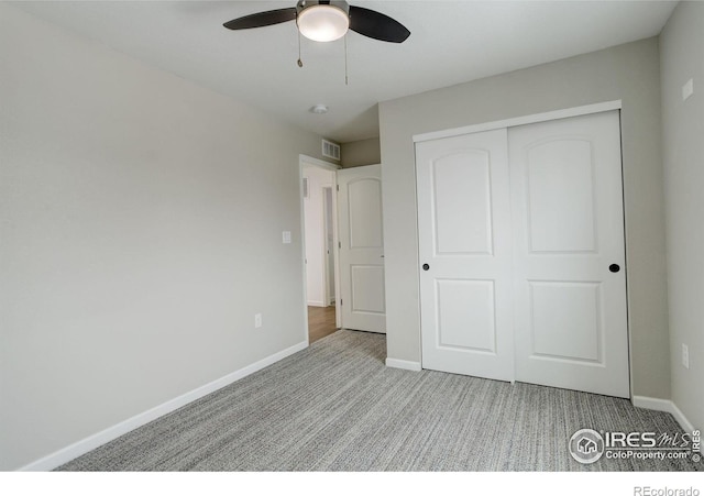 6506 Merrimack Dr, Castle Pines, CO 80108 - unfurnished bedroom with carpet floors, baseboards, a closet, and a ceiling fan