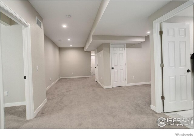 6506 Merrimack Dr, Castle Pines, CO 80108 - finished below grade area with carpet flooring, recessed lighting, and baseboards