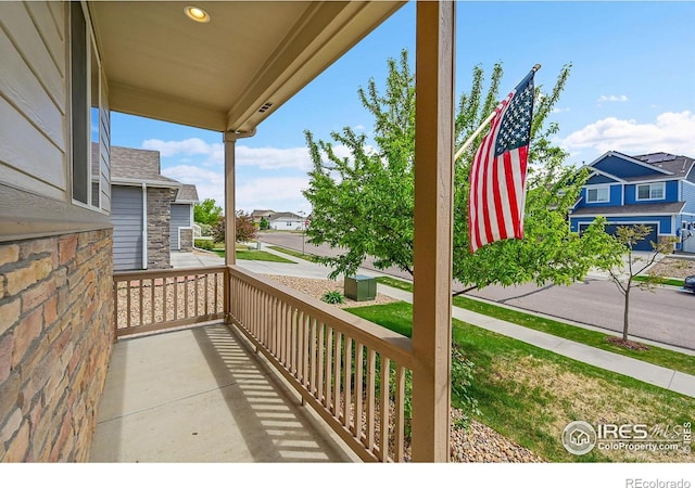711 Mt Evans Ave, Severance, CO 80550 - balcony featuring covered porch and a residential view