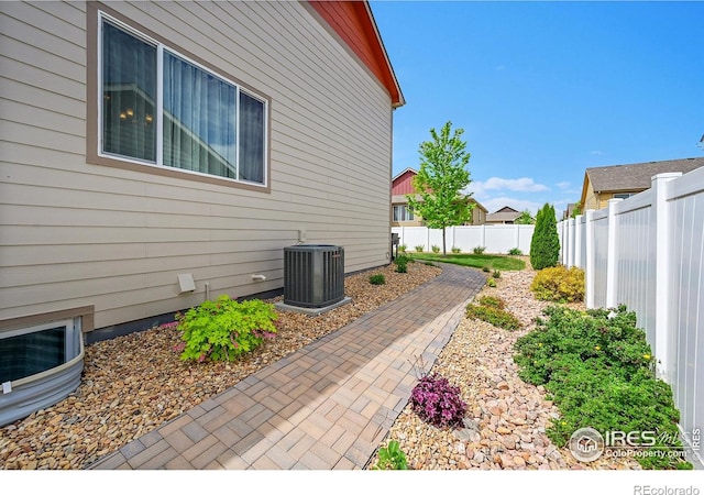 711 Mt Evans Ave, Severance, CO 80550 - view of patio with central AC unit and a fenced backyard