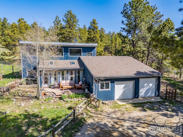 1824 Lazy Z Rd, Nederland, CO 80466 - view of front of property featuring an outdoor living space, driveway, and fence